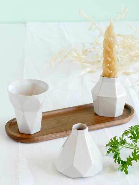 Modern geometric Judaica set - ceramic Havdalah set, consist of all items needed for a Havdalah weekly ritual - a wine cup, a candleholder and Besamim holder - all slip casted of beige clay, glazed in off- white glaze.
An oval bamboo plate - to hold all set parts together and to collect wine drops - is included.
Designed in contemporary style, this set is perfect as a trendy Judaica gift, for wedding, Bar-Mitzva, Bat Mitzvah or any other Jewish celebration and holydays.