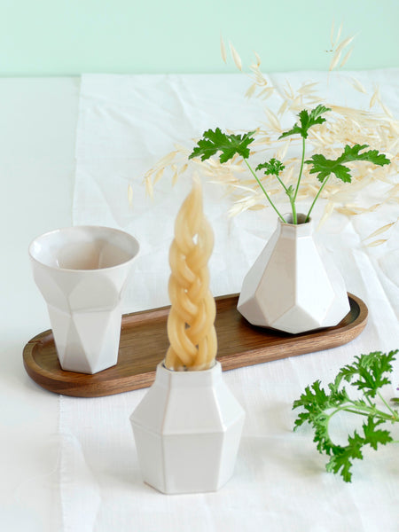 Modern geometric Judaica set - ceramic Havdalah set, consist of all items needed for a Havdalah weekly ritual - a wine cup, a candleholder and Besamim holder - all slip casted of beige clay, glazed in off- white glaze.
An oval bamboo plate - to hold all set parts together and to collect wine drops - is included.
Designed in contemporary style, this set is perfect as a trendy Judaica gift, for wedding, Bar-Mitzva, Bat Mitzvah or any other Jewish celebration and holydays.