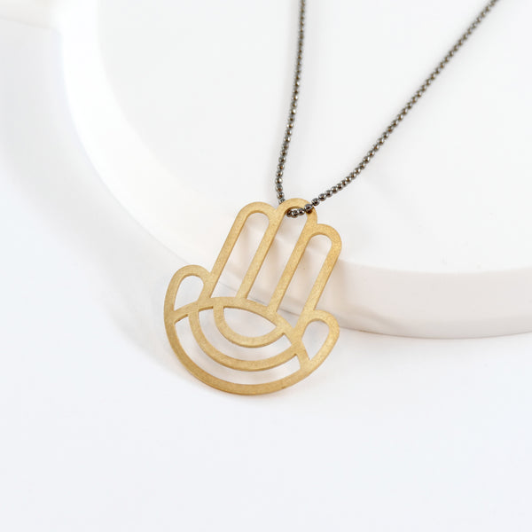 Geometric Hamsa Pendant Made of Golden Brass