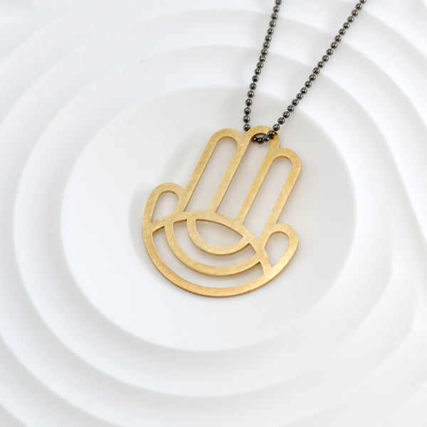 Geometric Hamsa Pendant Made of Golden Brass