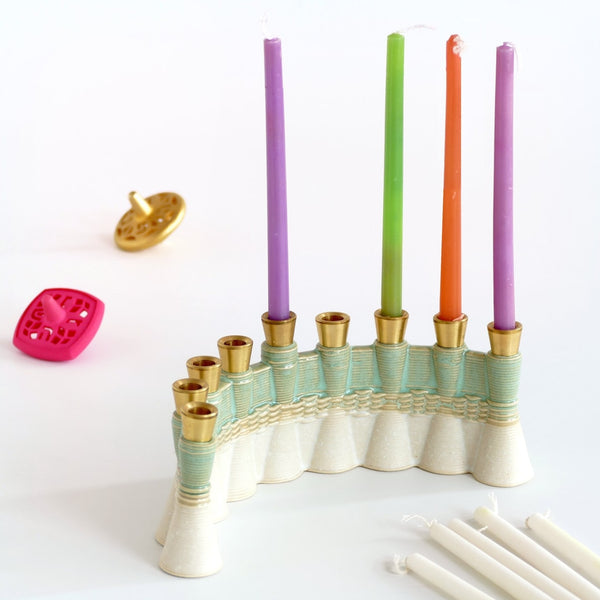 This innovative Hanukkah Menorah has an arc shape with weaving pattern - created in a unique method by a clay 3D Printer. Its gentle details and modest proportions - make it look like a jewel.