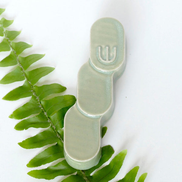Green mezuzah case. Original design by Studio Armadillo