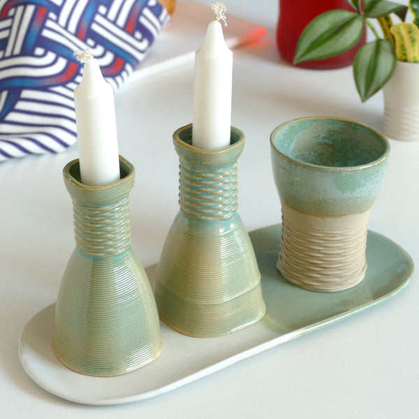 An original gift idea for modern Jewish family - consist of Kiddush cups, pair of candlesticks, and an oval plate. Created in a unique method by a clay 3D Printer.