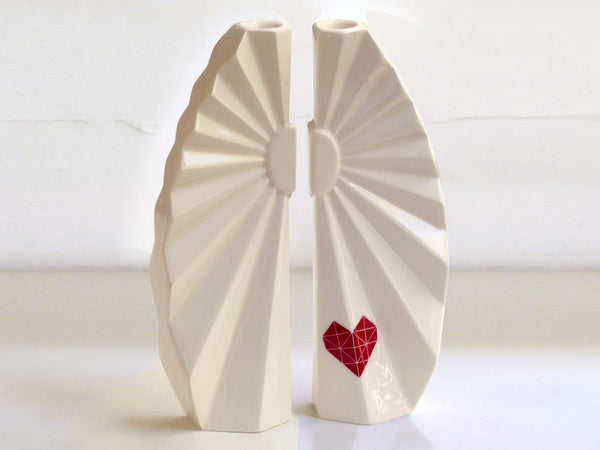 A Pair of candlesticks designed in geometric style, the white ceramic candle holders with red heart decal are a beautiful contemporary Judaica wedding gift or Bat-Mitzvah gift.