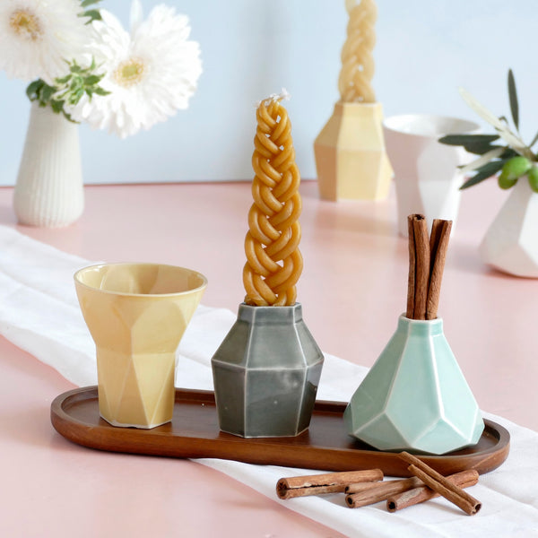 Mystery box of Havdalah set, consist of all items needed for a Havdalah weekly ritual - a wine cup, a candleholder and Besamim holder - all made of molded clay. A matching bamboo tray - is an addition to this set to hold all set parts together.
The parts of this set are fixed - the glazes combination varies from a range of pastel colors, off-white and gray.