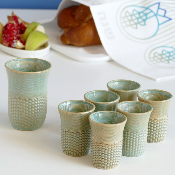 This elegant Shabbat table set includes a Kiddush cup with matching six small wine goblets, all have a gentle pearls pattern - created in a unique method by a clay 3D Printer.
