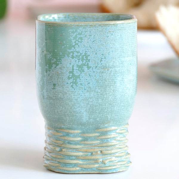 This Kiddush cup has a square shape and a gentle weaving pattern on its leg - created in a unique method by a clay 3D Printer. Enjoy now - for a limited time only - Early Bird Sale of 3D Printed Clay Kiddush cup.