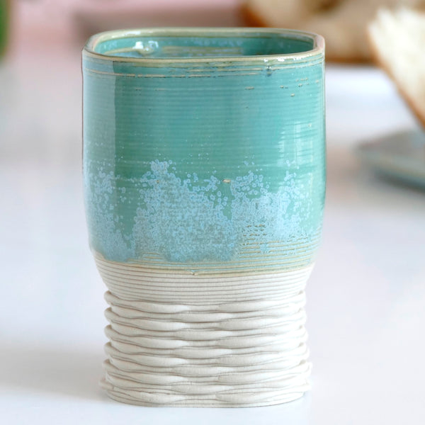This elegant Kiddush wine goblet has a square shape and weaving pattern on its leg - created in a unique method by a clay 3D Printer.