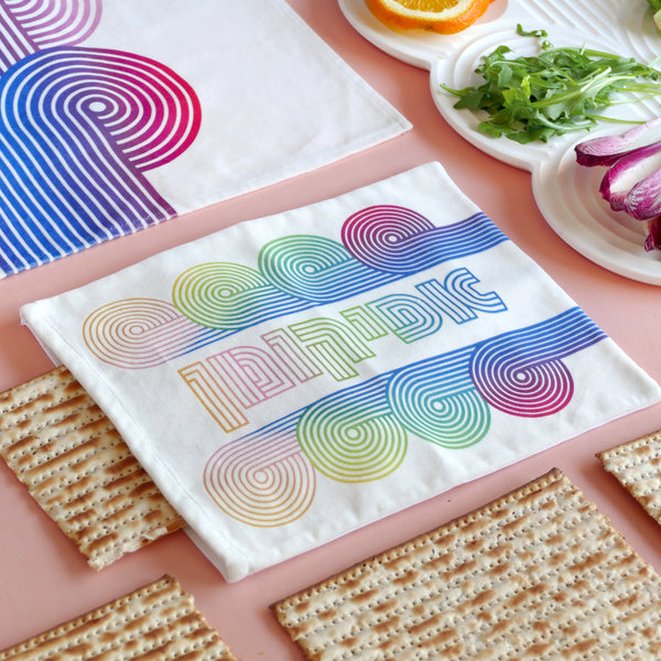 Matzah cover and afikomen set, op art waves pattern printed on off white cotton velvet, the design draws inspiration from the story of Exodus, merging tradition with contemporary aesthetic.