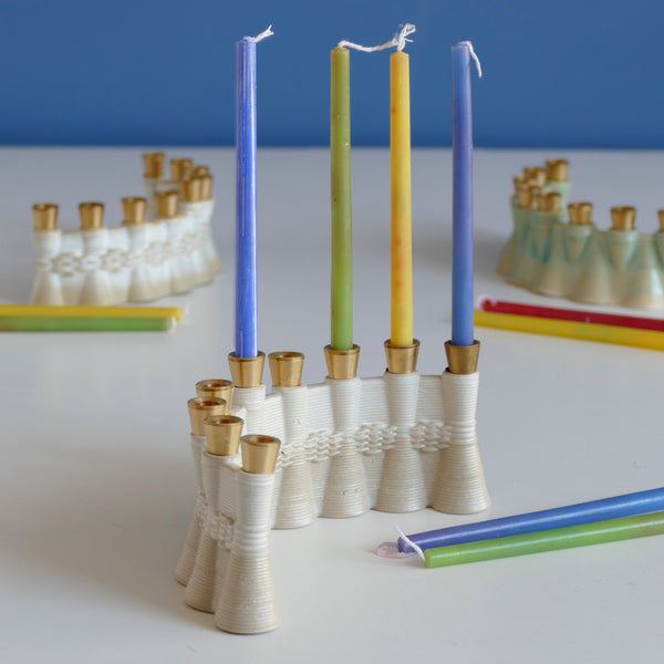 This innovative Hanukkah Menorah has an arc shape with weaving pattern - created in a unique method by a clay 3D Printer. Its gentle details and modest proportions - make it look like a jewel.  The Shamash placed at the middle of the arc, you may place the Menorah concave or convex.