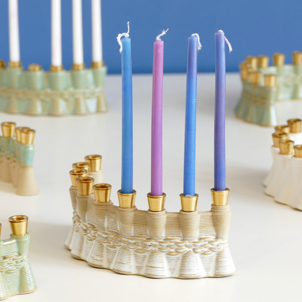 This innovative Hanukkah Menorah has an arc shape with weaving pattern - created in a unique method by a clay 3D Printer. The Shamash placed at the edge of the arc, you may choose setting the Menorah concave or convex - with the Shamash on the right or on the left.