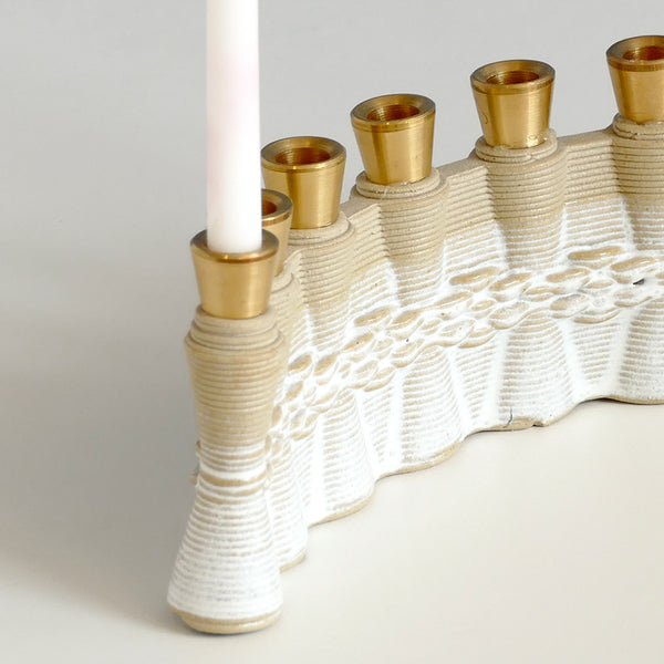 This innovative Hanukkah Menorah has an arc shape with weaving pattern - created in a unique method by a clay 3D Printer. The Shamash placed at the edge of the arc, you may choose setting the Menorah concave or convex - with the Shamash on the right or on the left.