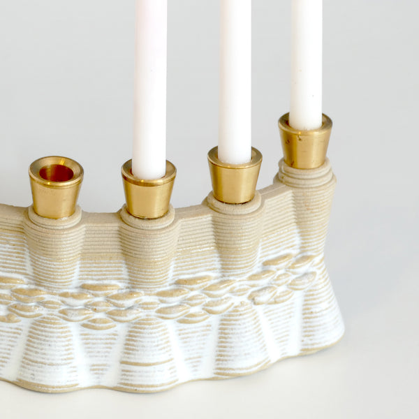 This innovative Hanukkah Menorah has an arc shape with weaving pattern - created in a unique method by a clay 3D Printer. Its gentle details and modest proportions - make it look like a jewel.