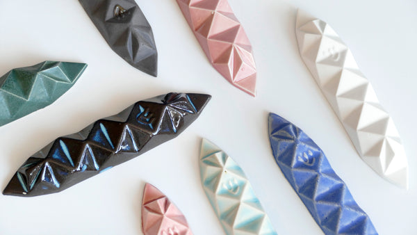 Mystery box of 3 Mezuzah cases, hand made of ceramic - inspired by Origami.
The box includes three Mezuzah cases in the same design - the glazes combination is a surprise - three different colors - in attractive discount of 50%.