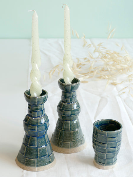 With its geometric checkered grid pattern - these Kiddish set brings the newest design trend to your Shabbat evening table.
Inspired by 60's and 80's pop style - These emerald shade ceramic candle holders and wine cup are a beautiful contemporary Jewish wedding gift or Bat-Mitzvah gift.