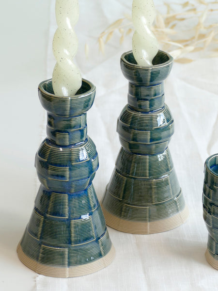 With its geometric checkered grid pattern - these Kiddish set brings the newest design trend to your Shabbat evening table.
Inspired by 60's and 80's pop style - These emerald shade ceramic candle holders and wine cup are a beautiful contemporary Jewish wedding gift or Bat-Mitzvah gift.