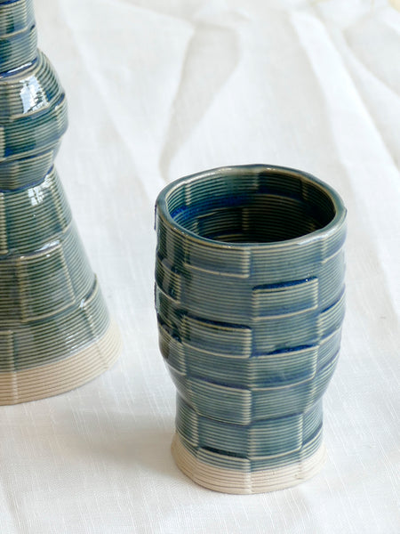 With its geometric checkered grid pattern - these Kiddish set brings the newest design trend to your Shabbat evening table.
Inspired by 60's and 80's pop style - These emerald shade ceramic candle holders and wine cup are a beautiful contemporary Jewish wedding gift or Bat-Mitzvah gift.