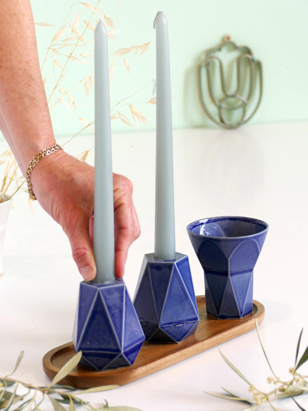 Pair of geometric pentagon candlesticks designed in modern style. These candle holders slip casted of off white clay with royal blue glaze, fits tall festive candles or Shabbat candles in traditional glass cups.