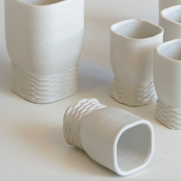 modern white ceramic Kiddush cup - made in Israel in 3d clay printer - weaving texture details make it look like a jewel