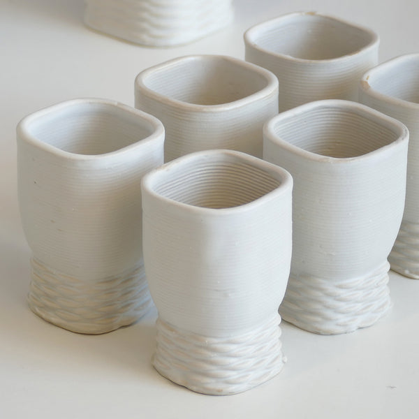 modern white ceramic Kiddush cup - made in Israel in 3d clay printer - weaving texture details make it look like a jewel