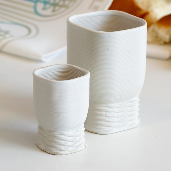 This elegant Kiddush cups set has clean square shape with weaving pattern at its bottom - created in a unique method by a clay 3D Printer