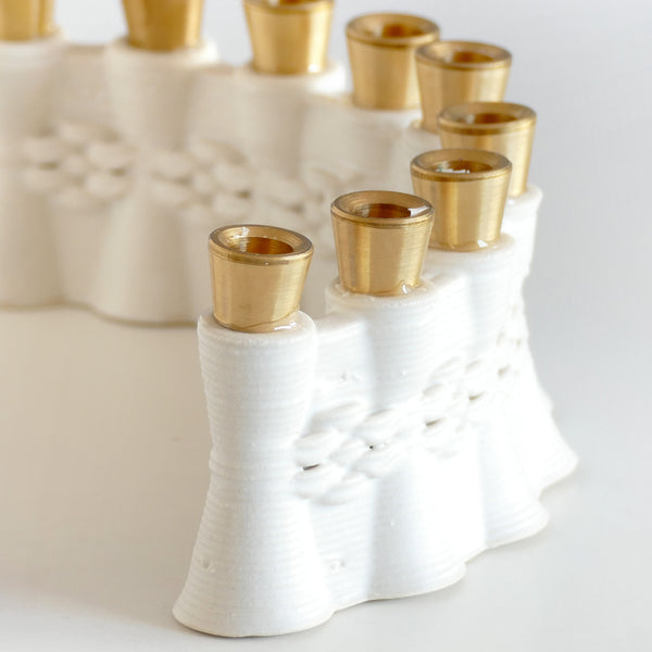innovative Hanukkah Menorah has an arc shape with cones pattern - created in a unique method by a clay 3D Printer. Its gentle details and modest proportions - make it look like a jewel.