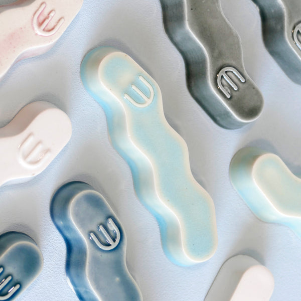 Original Mezuzah case design - clean geometric lines, pop Zig Zag shape, molded in clay, sealed in light blue glaze. Inspired by pop art, and 80's style, this is a minimalist sophisticated addition to your home entrance and indoor openings.
