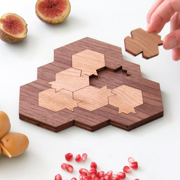 challenging wooden mind game, based on pomegranate and honeycomb shapes