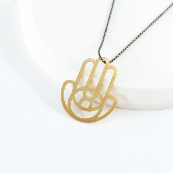 Geometric Hamsa Pendant Made of Golden Brass- An Open Eye