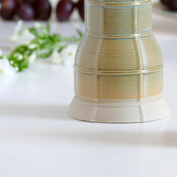 An innovative Shabbat table set, with Pair of candlesticks and Kiddush cup. Designed in geometric modern Judaica style, manufactured in our studio in a unique method of clay 3D printing.