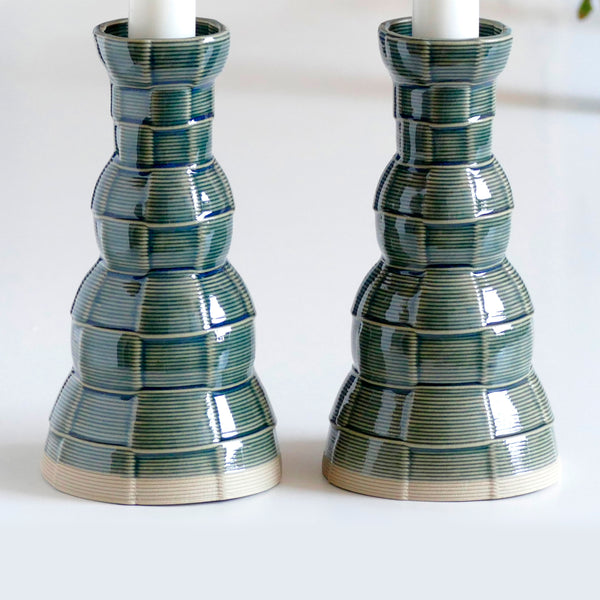 An innovative Shabbat table set, with Pair of candlesticks and Kiddush cup. Designed in geometric modern Judaica style, manufactured in our studio in a unique method of clay 3D printing.
With its geometric checkered grid pattern - these Kiddish set brings the newest design trend to your Shabbat evening table.