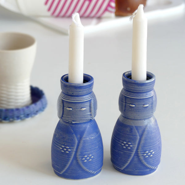 3D printed Ceramic in a natural off white shade. Royal blue glaze, shabbat pair of candlesticks inspired by Japanese Kokeshi dolls