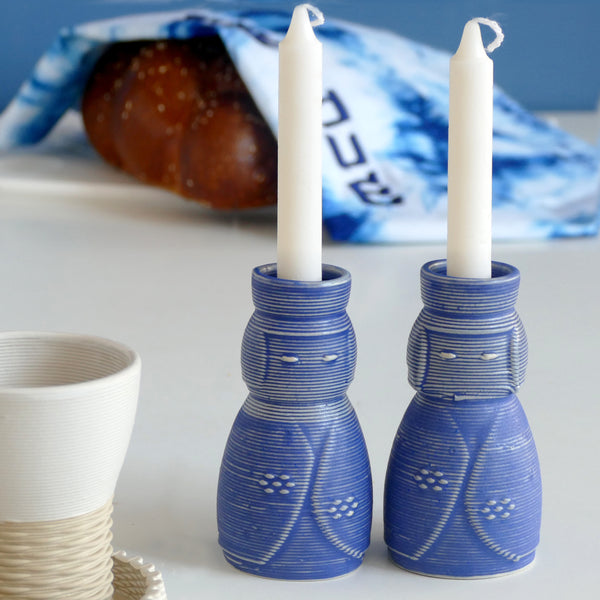 3D printed Ceramic in a natural off white shade. Royal blue glaze, shabbat pair of candlesticks inspired by Japanese Kokeshi dolls