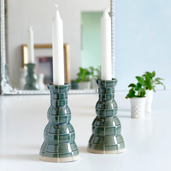 With its geometric checkered pattern - these candleholders bring the newest design trend to your Shabbat evening table. Inspired by 60's and 80's pop style - These emerald ceramic candle holders are a beautiful contemporary Jewish gift