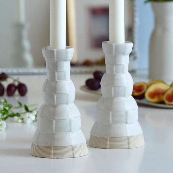 An innovative Shabbat table set, with Pair of candlesticks and Kiddush cup. Designed in geometric modern Judaica style, manufactured in our studio in a unique method of clay 3D printing.