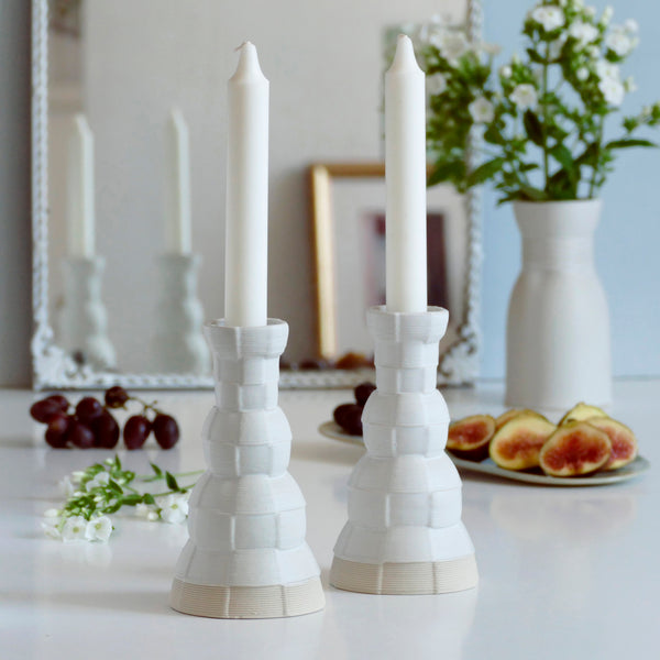 An innovative Shabbat table set, with Pair of candlesticks and Kiddush cup. Designed in geometric modern Judaica style, manufactured in our studio in a unique method of clay 3D printing.