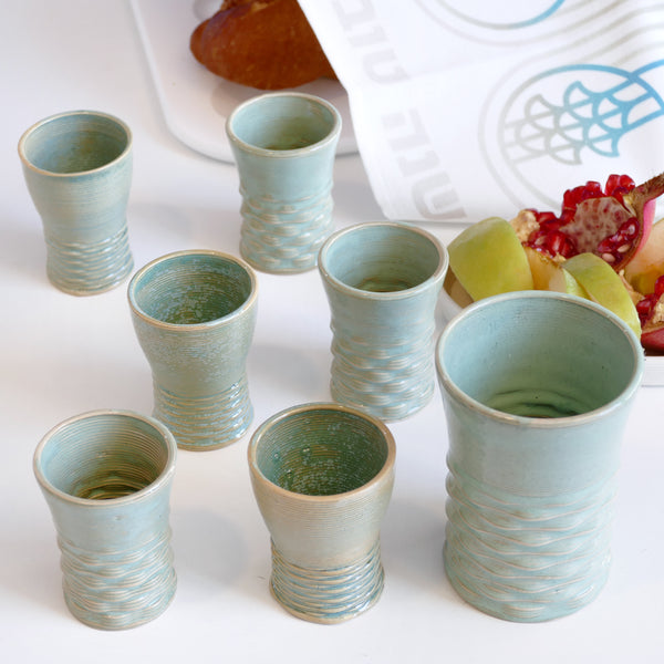This elegant Shabbat table set includes a Kiddush cup with matching six small wine goblets, all have a gentle pearls pattern - created in a unique method by a clay 3D Printer.