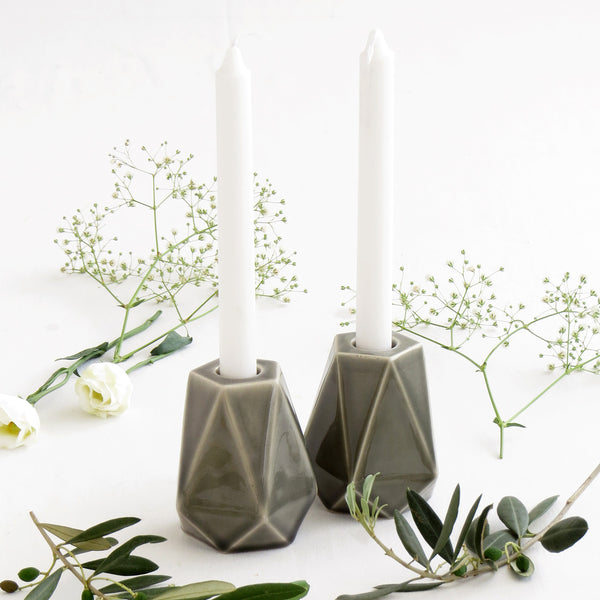 Pair of geometric pentagon candlesticks designed in modern style. These candle holders made of ceramic with grey glaze, fits tall festive candles or Shabbat candles in traditional glass cups.