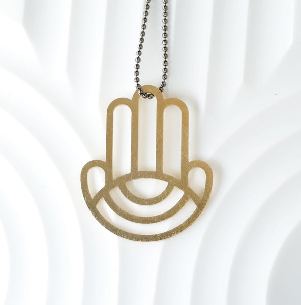 Geometric Hamsa Pendant Made of Golden Brass