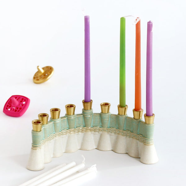 This innovative Hanukkah Menorah has an arc shape with weaving pattern - created in a unique method by a clay 3D Printer. Its gentle details and modest proportions - make it look like a jewel.
