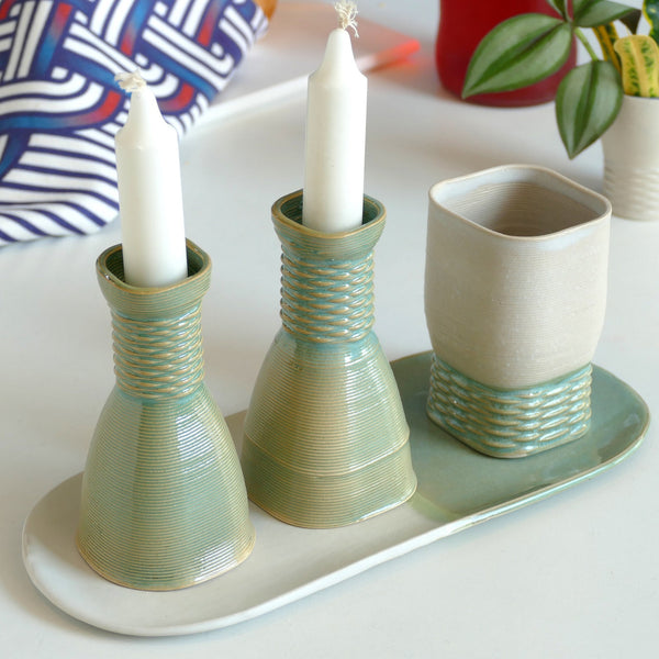 An original gift idea for modern Jewish family - consist of Kiddush cups, pair of candlesticks, and an oval plate. Created in a unique method by a clay 3D Printer.