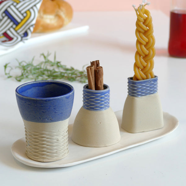 This modern Ceramic Judaica set - consist of all items needed for a Havdalah weekly ritual - a wine cup, a candleholder, Besamim holder and a plate - to hold all set parts together and to collect wine drops.