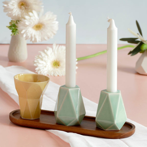 Mystery box of Shabbat table set, includes a Hexagon shaped Kiddush cup and pair of pentagon candlesticks, with matching bamboo tray.
The items that make up each set are fixed - the glazes combination varies from a range of pastel colors, off-white and gray.
Pictures show different combinations of glazes - the exact colors combination of your set is a surprise.