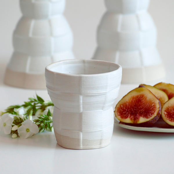 With its geometric checkered pattern - these Kiddish set brings the newest design trend to your Shabbat evening table. Inspired by 60's and 80's pop style - These beige and off- white shade ceramic candle holders and wine cup are a beautiful contemporary Jewish gift