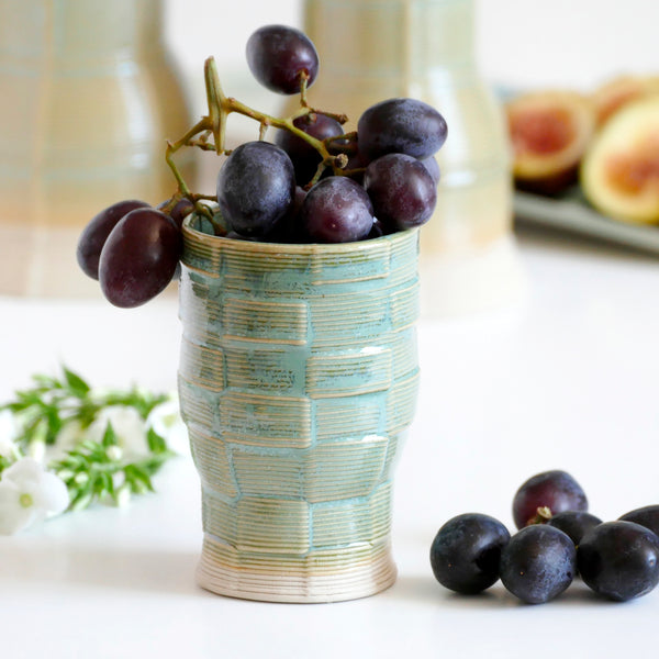 With its geometric checkered grid pattern - these Kiddish set brings the newest design trend to your Shabbat evening table. Inspired by 60's and 80's pop style - These mint shade ceramic candle holders and wine cup are a beautiful contemporary Jewish wedding gift or Bat-Mitzvah gift.