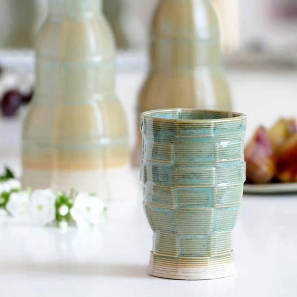 With its geometric checkered grid pattern - these Kiddish set brings the newest design trend to your Shabbat evening table. Inspired by 60's and 80's pop style - These mint shade ceramic candle holders and wine cup are a beautiful contemporary Jewish wedding gift or Bat-Mitzvah gift.