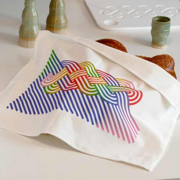 the graphic Challah print of this cover matches perfectly the more minimalistic Challah design engraved on our Corian Challah board - Together they make a perfect Shabbat Set