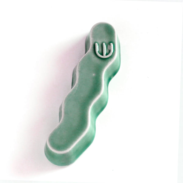 Original Mezuzah case design - clean geometric lines, pop Zig Zag shape, molded in clay, sealed in emerald green glaze.