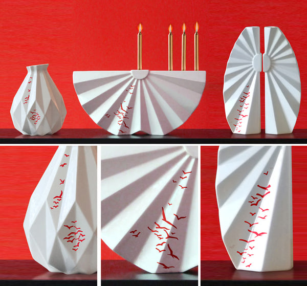 A Pair of candlesticks designed in geometric style, the white ceramic candle holders with birds pattern are a beautiful contemporary Judaica wedding gift or Bat-Mitzvah gift.
Designed like a pair of fans creating together a glamorous look