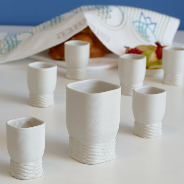 This elegant Kiddush cups set has clean square shape with weaving pattern at its bottom - created in a unique method by a clay 3D Printer